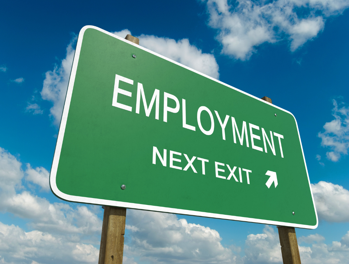 Green Employment sign with the words "Employment next left"
